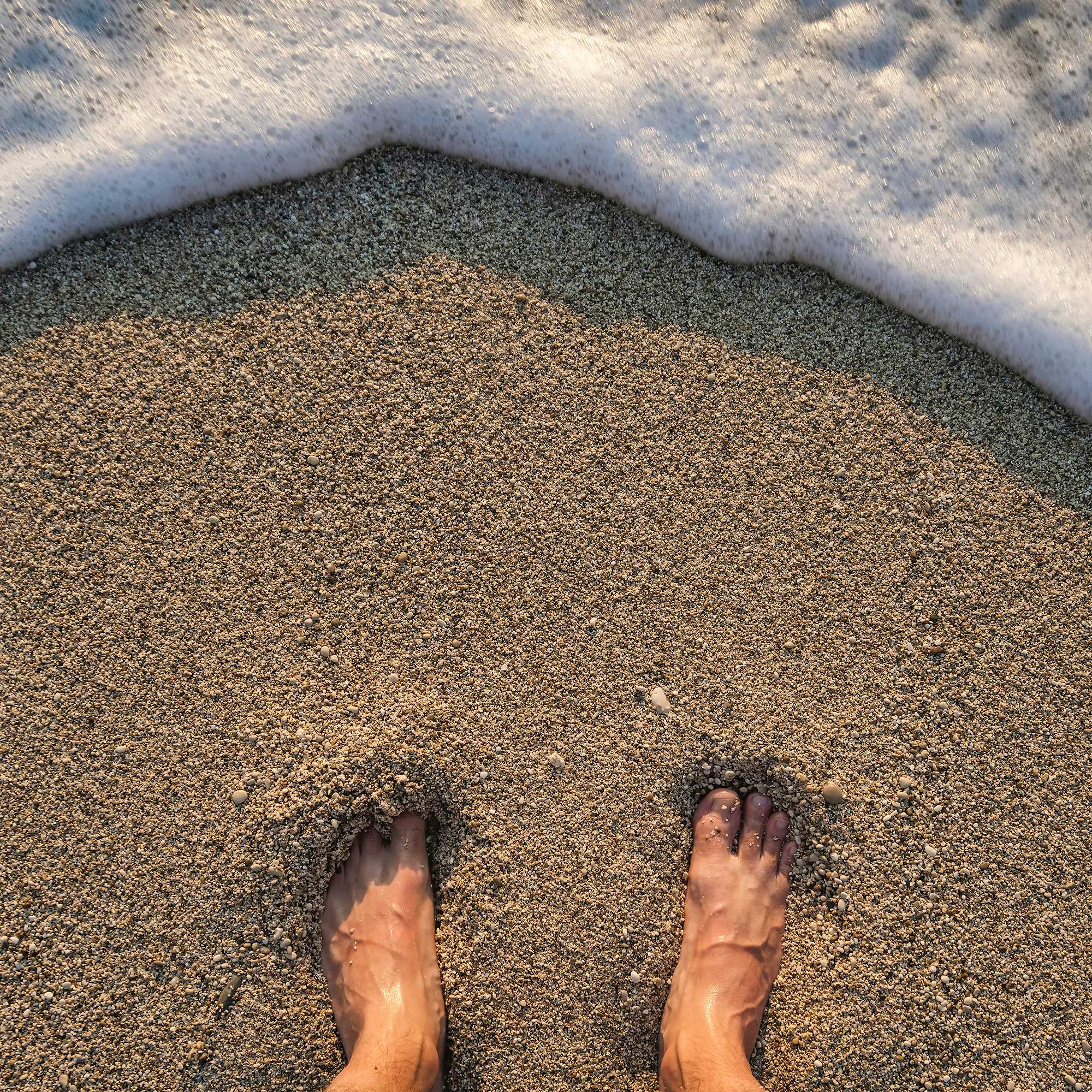 Photo Caption: Enjoy fine sand at the beach 20 steps away