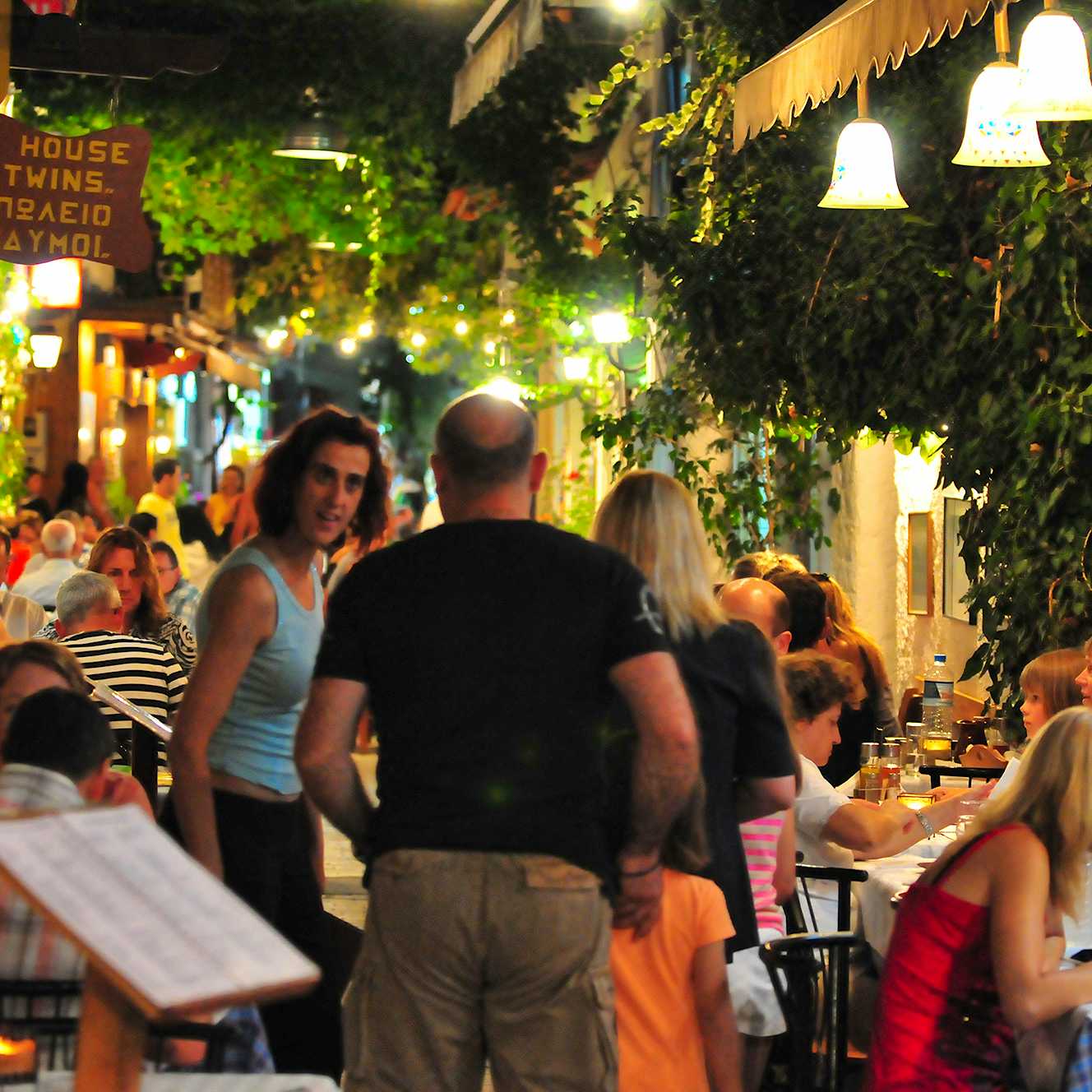 Photo Caption: Eat at traditional tavernas & experience the vibrant nightlife
