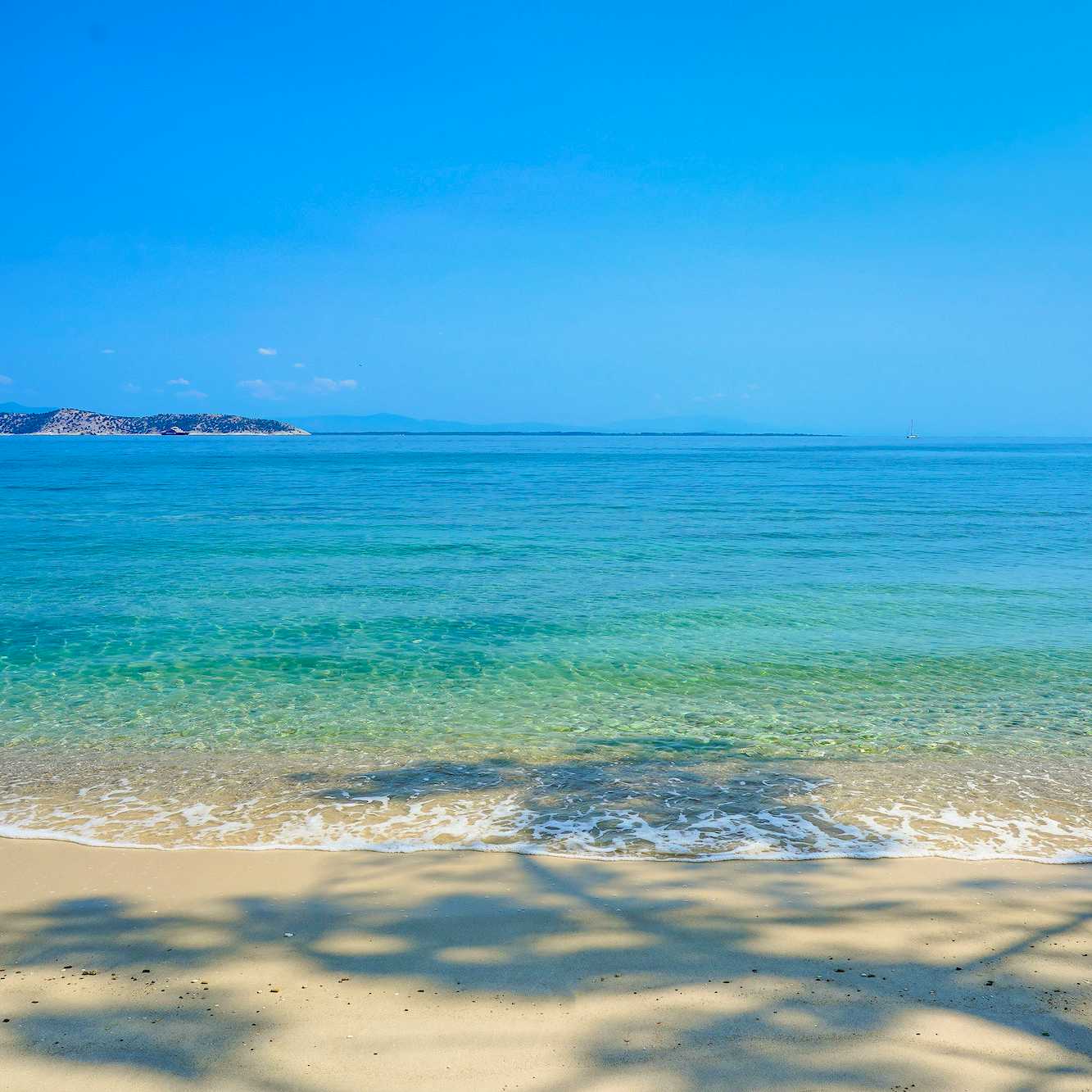 Photo Caption: Enjoy a swim nearby at sandy beaches like this one