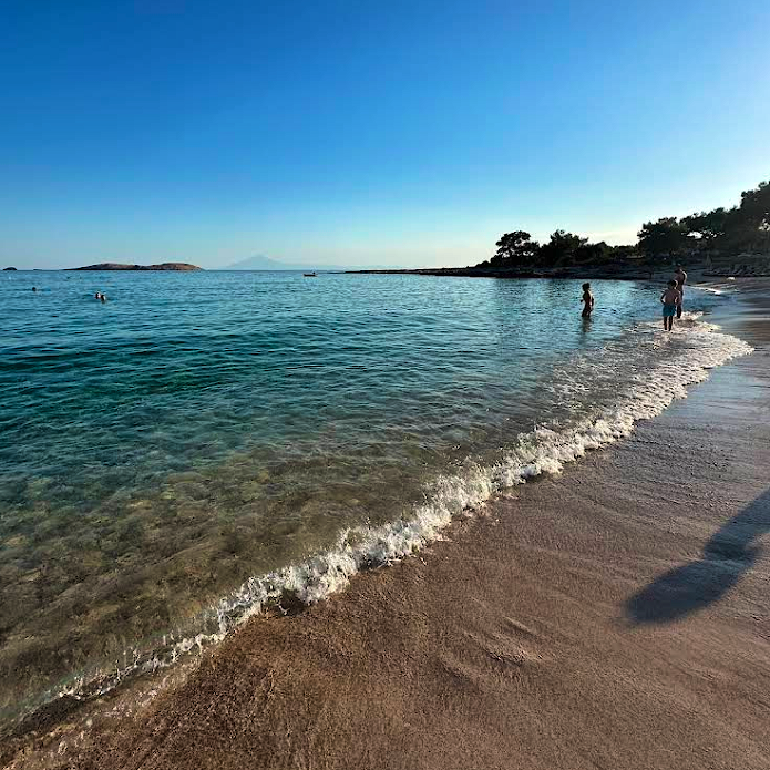 Photo Caption: Swim in the clear, calm waters of Trypiti Beach
