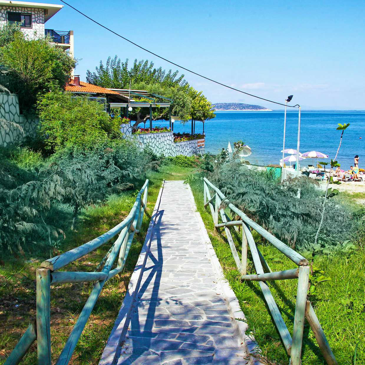 Photo Caption: Take our private pathway to the sandy Nisteri Beach
