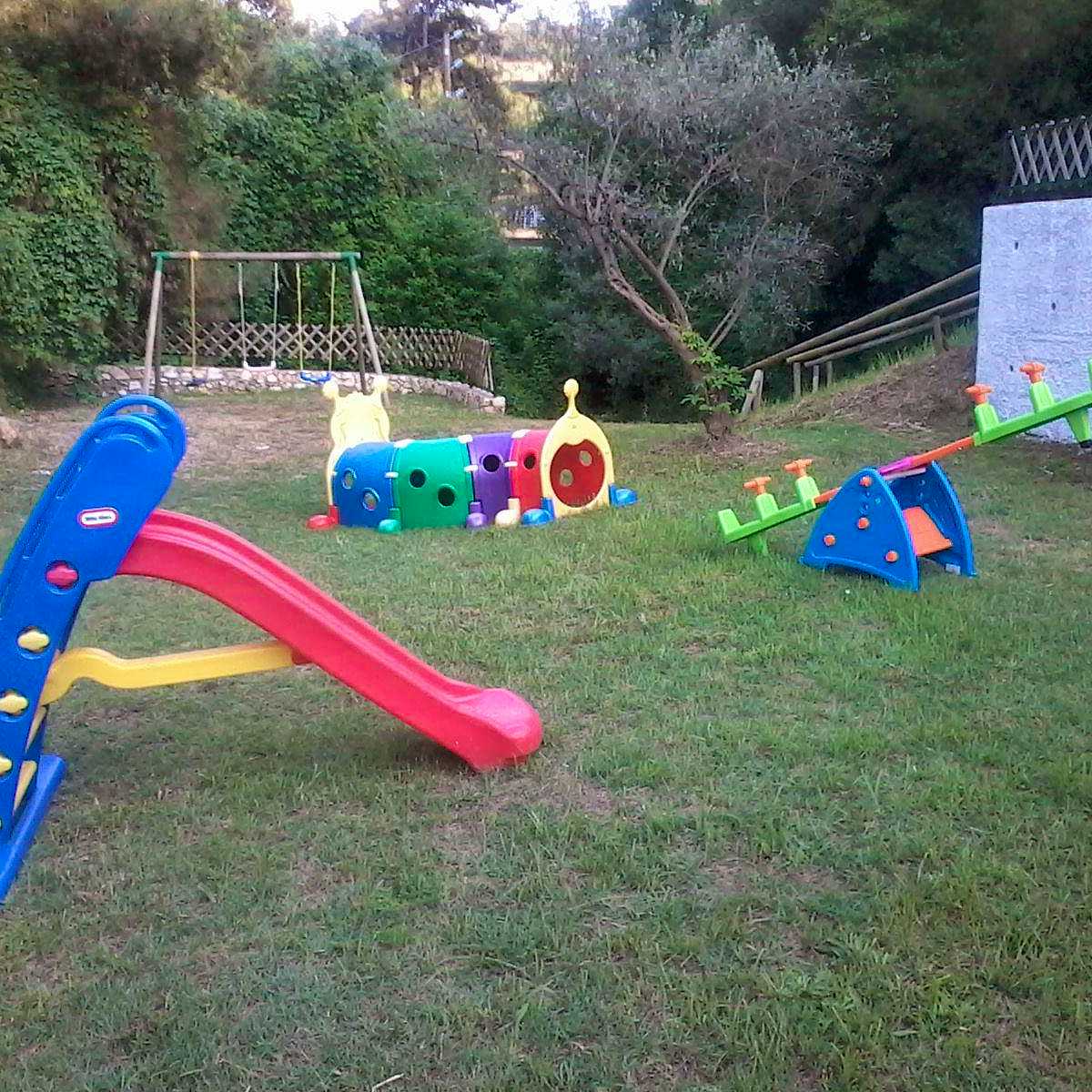 Photo Caption: Watch the children play safely in the garden's playground
