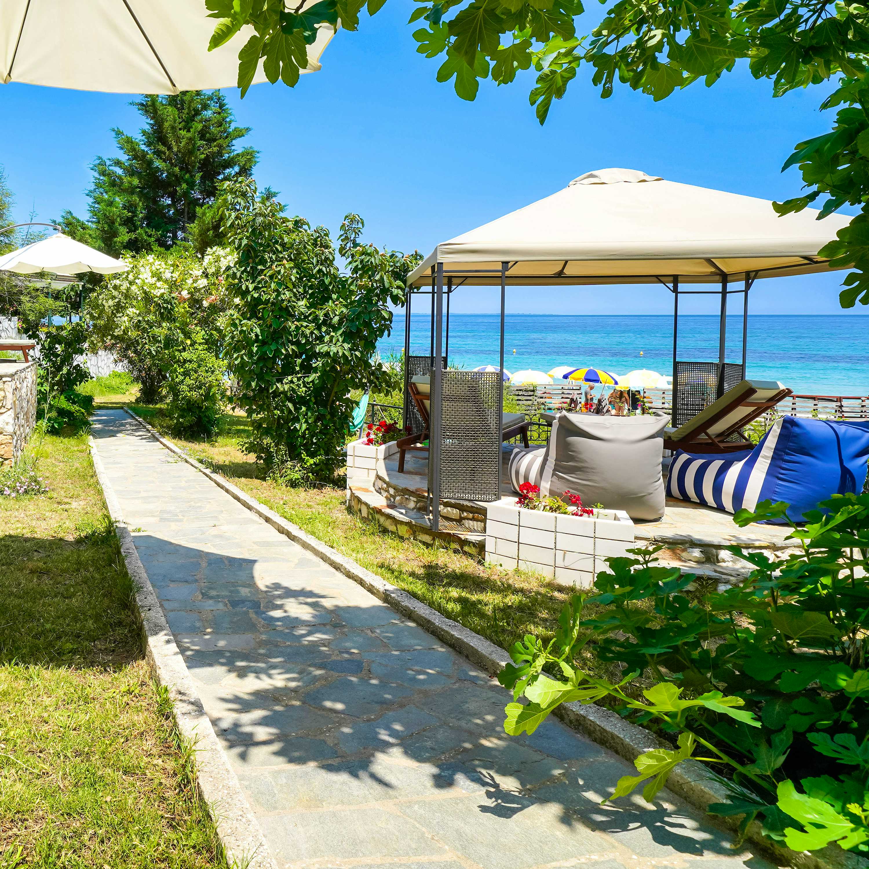 Photo Caption: Take our private pathway to the sandy Nisteri Beach